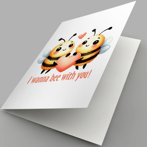 Greeting card with cartoon bees holding a heart and text 'I wanna bee with you!' on a gray background