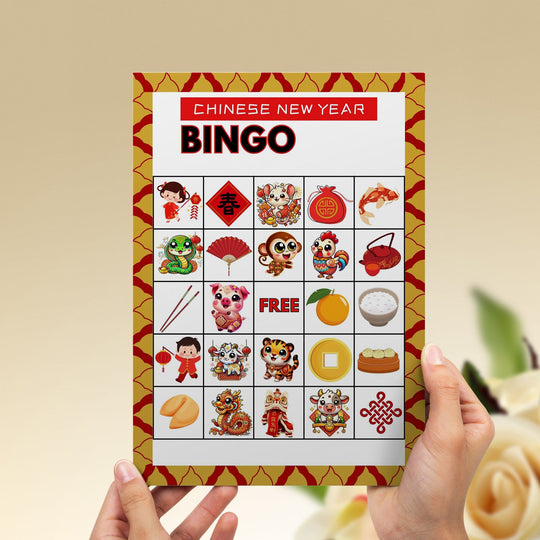 someone holding the printable Chinese New Year Bingo Game
