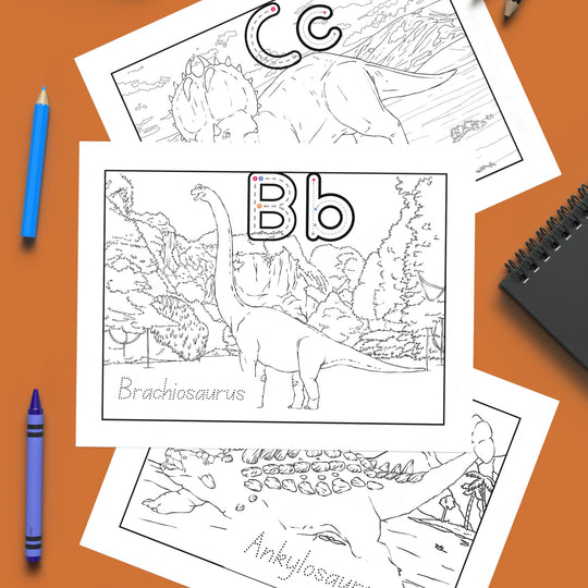 A-Z Dino Coloring Book with crayons on an orange background