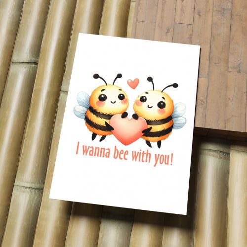Printable Valentine’s Day & Anniversary Card with cartoon bees holding a heart and text 'I wanna bee with you!' on a wooden surface.