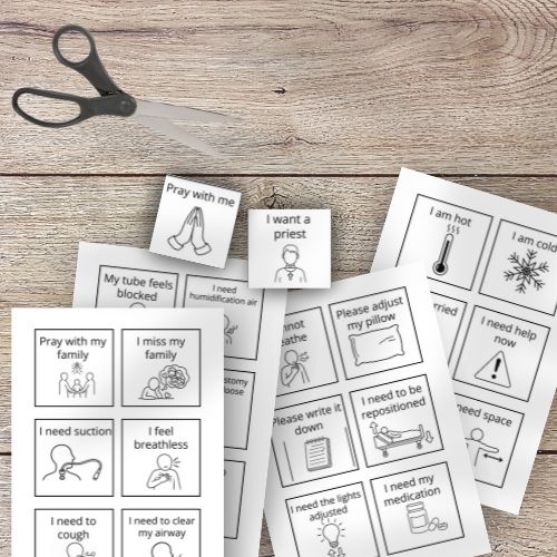 Set of Spiritual, Emotional & Medical Communication Cards with illustrations and text on a wooden surface with scissors.