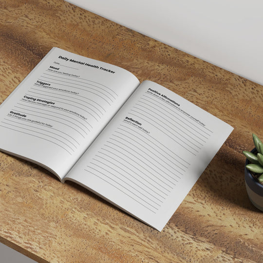 open workbook on a wood table top