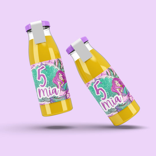 Two bottles with colorful labels featuring a mermaid design on a light purple background