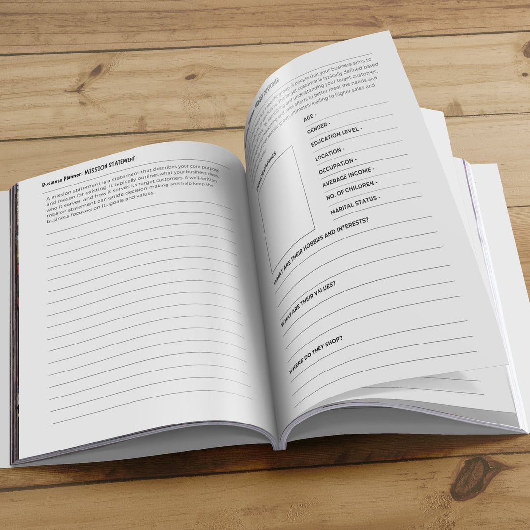 An open workbook on a wood floor