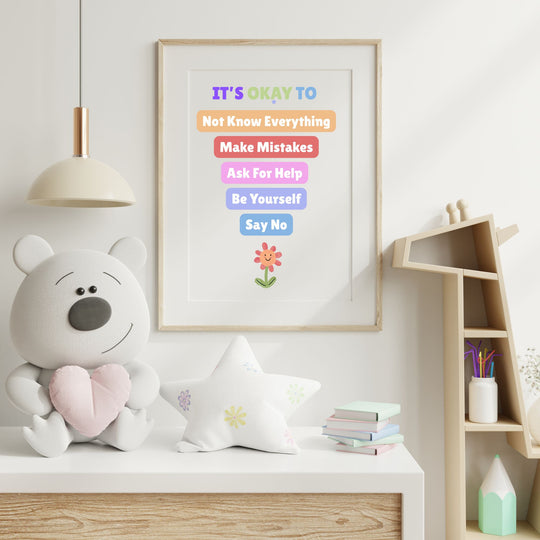 a kids poster in a room next to a cute soft toy with a desk, shelves